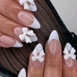 Elegant White Nail Art with 3D Floral Design